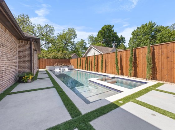 Narrow lap pool with spa and stepping stones